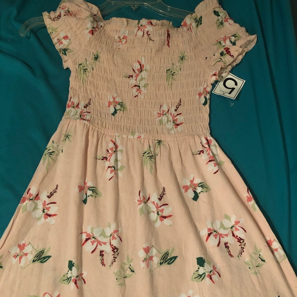 A pink dress with flowers on them